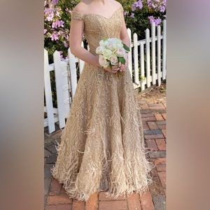Sherri hill gold ball gown with feathers off the shoulder